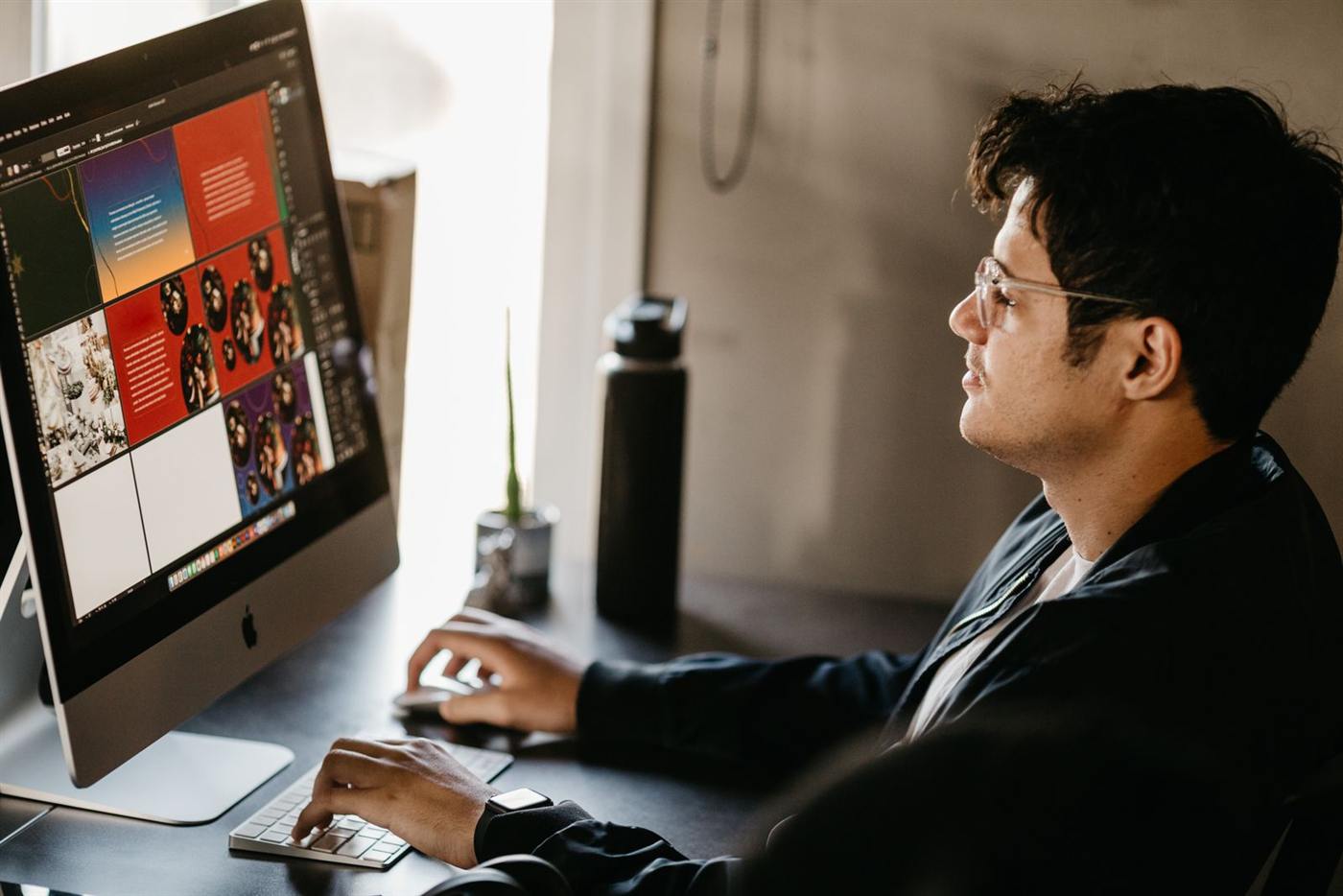 Designer working at a large monitor
