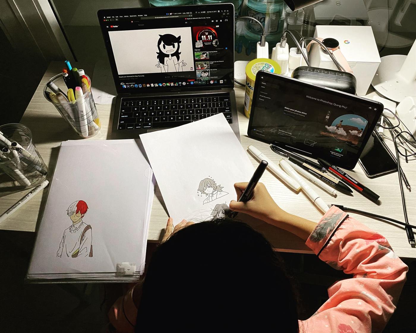 Designer sketching and working on a tablet